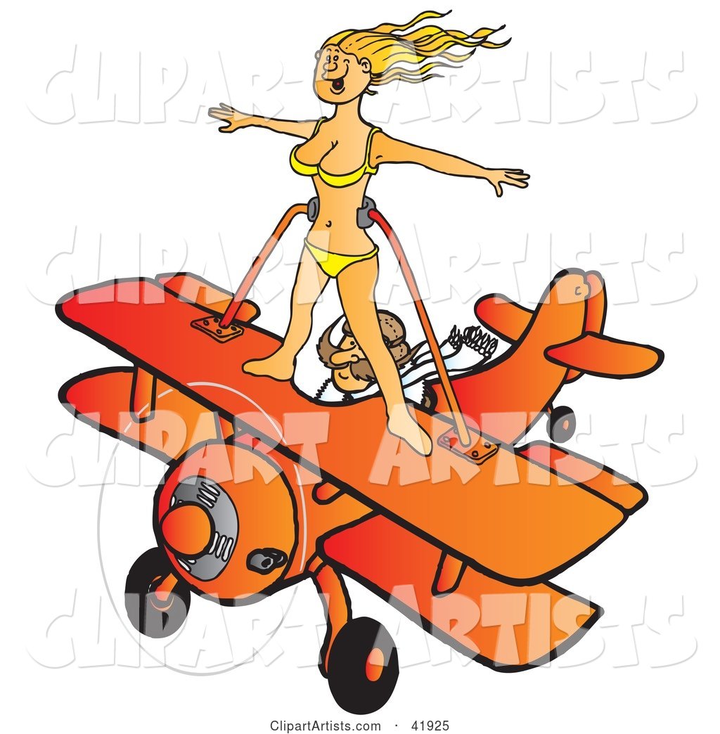 Pilot Flying an Orange Biplane While a Female Wingwalker in a Bikini Stands on the Wings
