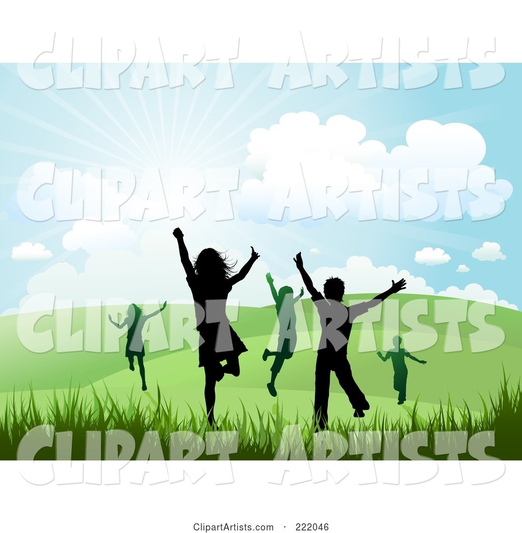 Silhouetted Happy Children Running and Jumping in a Hilly Summer or Spring Landscape
