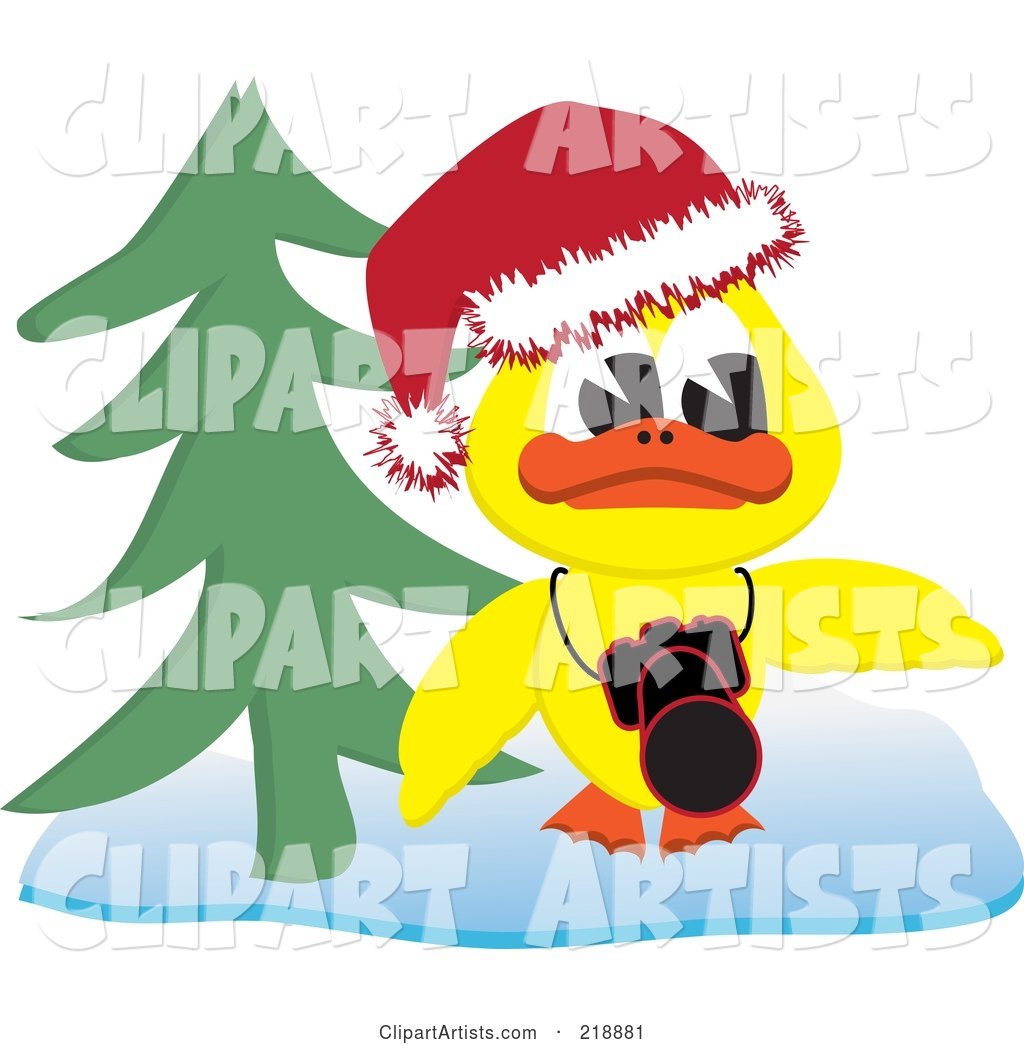 Yellow Christmas Duck with a Camera by a Christmas Tree