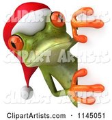 Green Christmas Frog Wearing a Santa Hat and Looking Around a Sign