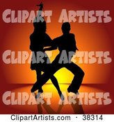 Sexy Black Silhouetted Couple Engaged in a Latin Dance