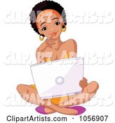 Beautiful Young Black College Student Sitting on the Floor with a Laptop