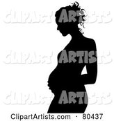 Black Silhouette of a Pregnant Woman in Profile, Touching Her Belly