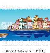 Boats and People in the Harbor near a Mediterranean Waterfront Town with Colorful Buildings