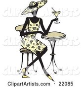 Fashionable Woman in Heels, a Paisley Dress and Matching Hat, Seated at a Cafe Table and Sipping a Cocktail