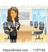 Happy Brunette Businesswoman Standing by a Meeting Table in an Office