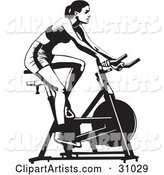 Healthy Woman Exercising on a Stationary Bicycle in a Gym