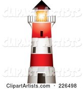 Red and White Lighthouse with a Bright Beacon Shining over the Balcony