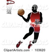 Silhouetted Basketball Player Leaping to the Hoop