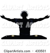 Silhouetted Male DJ Holding His Arm Sup Above Record Decks