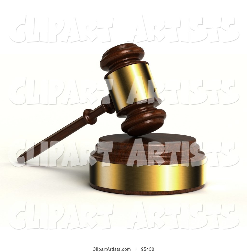 Wooden and Gold Gavel Resting on a Sound Block