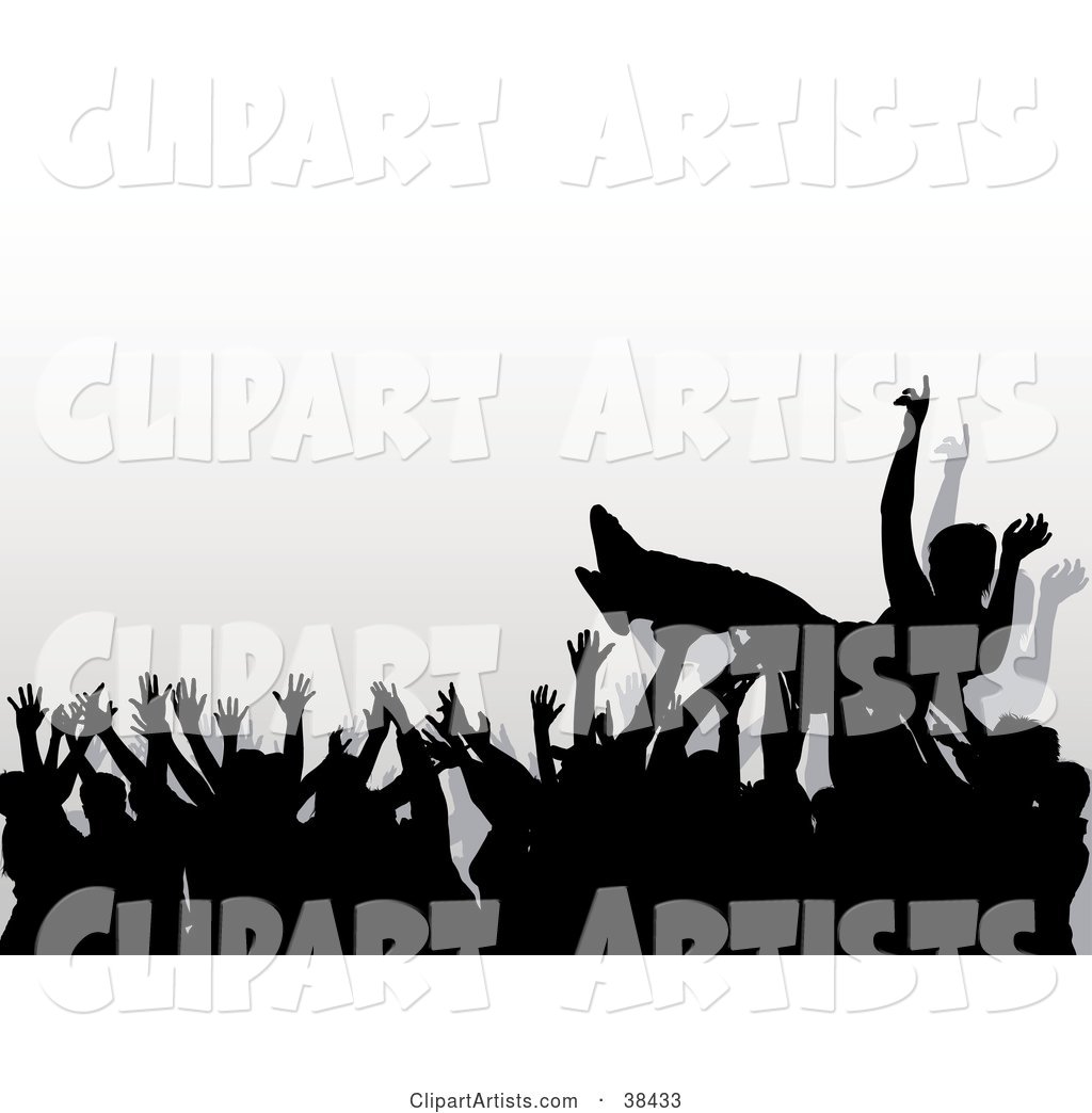 Concert Crowd of Silhouetted Hands Passing a Crowd Surfer