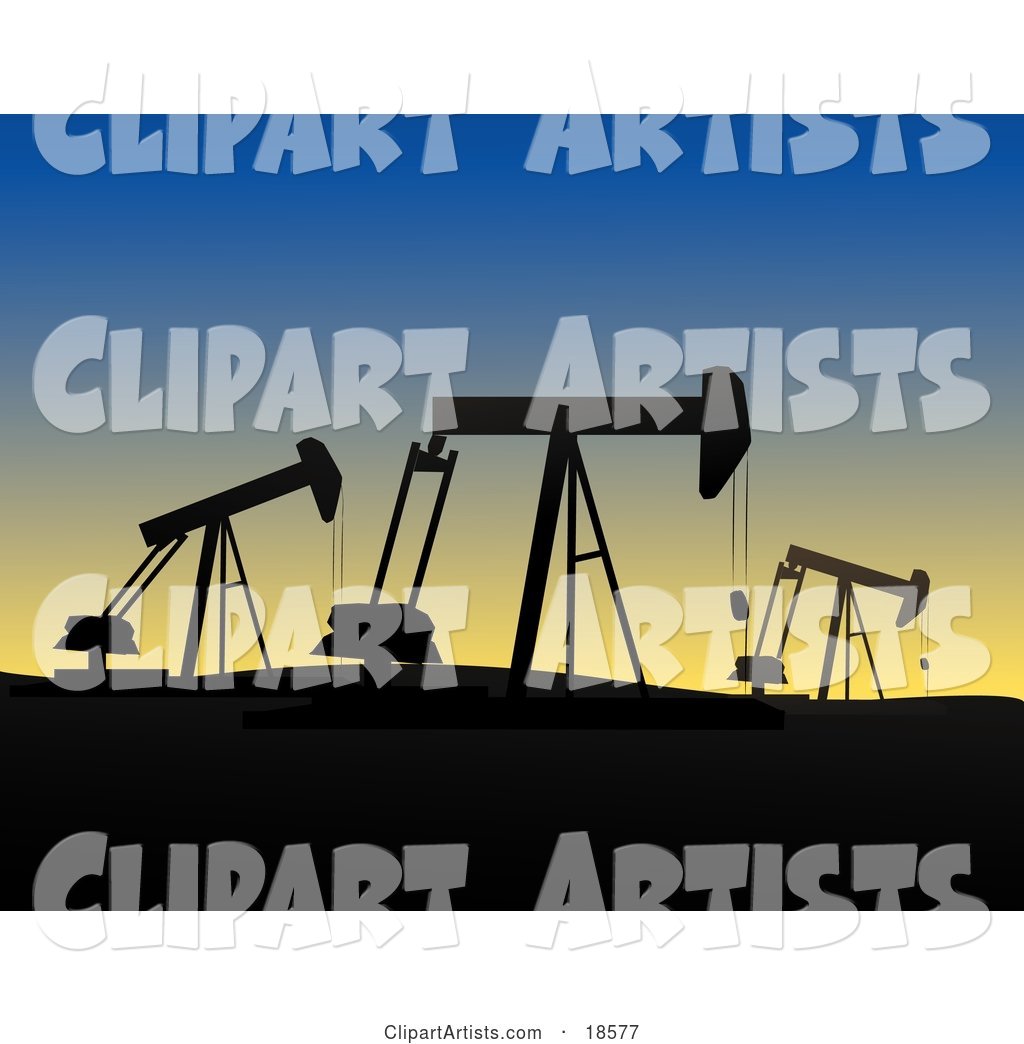 Field of Oil Derricks or Pump Jacks Silhouetted Against the Evening Sky While at Work in Oil Fields