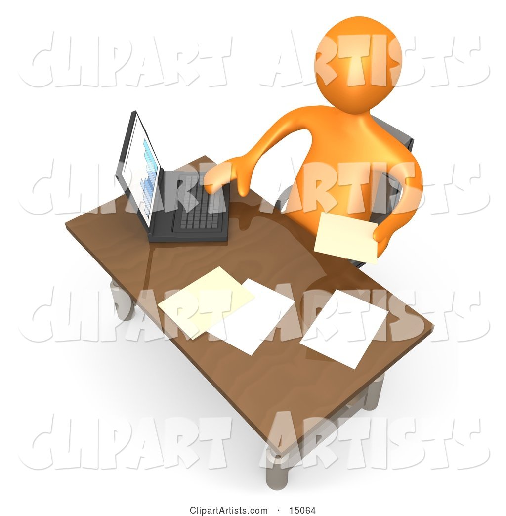 Orange Employee Seated at a Wooden Desk and Using a Laptop While Doing Paperwork at the Office