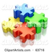 Different Sized Blue, Green, Red and Yellow Puzzle Pieces