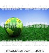 Shiny Green Globe Resting on a Grassy Hill Under a Blue Sky