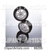 Stack of Three Rims and Tires
