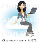 Beautiful Asian Businesswoman Holding a Laptop on a Cloud