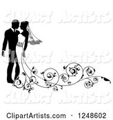 Black and White Silhouetted Wedding Couple with a Swirl Train