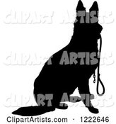 Black Silhouetted German Shepherd Dog Sitting with a Leash in His Mouth