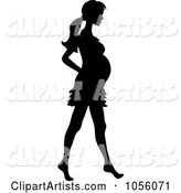 Black Silhouetted Pregnant Woman Walking Barefoot
