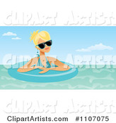 Blond Woman Wearing Shades and Floating in an Inner Tube