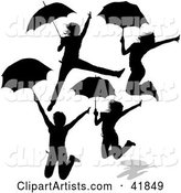 Four Silhouetted Women Jumping with Umbrellas