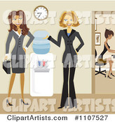 Friendly Businesswomen Talking by a Water Cooler in an Office