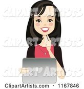 Happy Black Haired Woman Using a Laptop