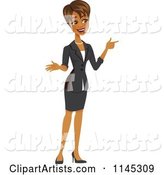 Happy Black or Indian Businesswoman Pointing