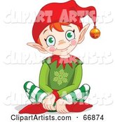 Happy Christmas Elf Sitting on the Floor