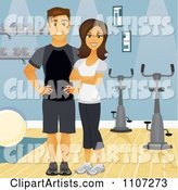 Happy Fit Couple or Personal Trainers near Spin Bikes in a Gym