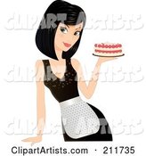 Pretty Black Haired Woman in an Apron, Holding a Cake in Hand