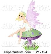 Pretty Blond Fairy Sitting on a Mushroom