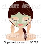 Relaxed Caucasian Woman with Her Hair in a Braid, Touching the Green Seaweed Mask on Her Face