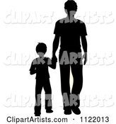 Silhouetted Father and Son Holding Hands