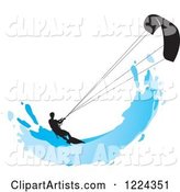 Silhouetted Kite Surfer with a Blue Splash