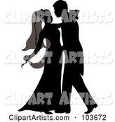 Silhouetted Newlywed Couple Dancing at Their Wedding