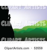 Silhouetted Rock Climber Along a Cliff over a Green Valley